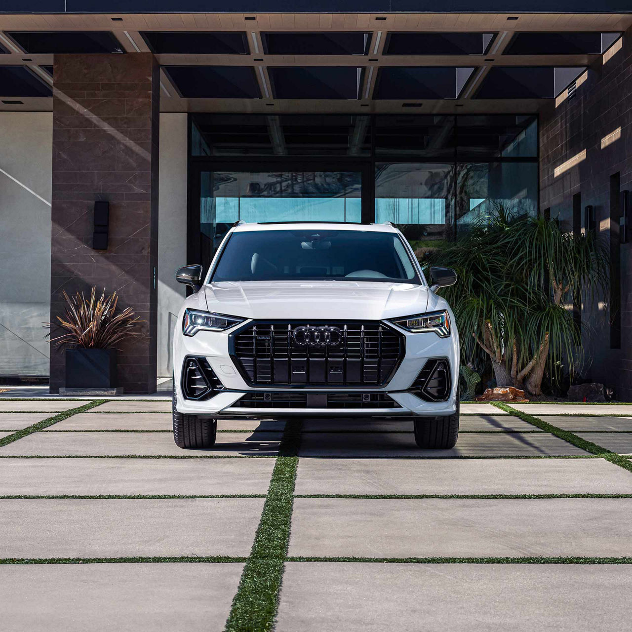 Three-quarter front view of a gray Audi Q4 e-tron.