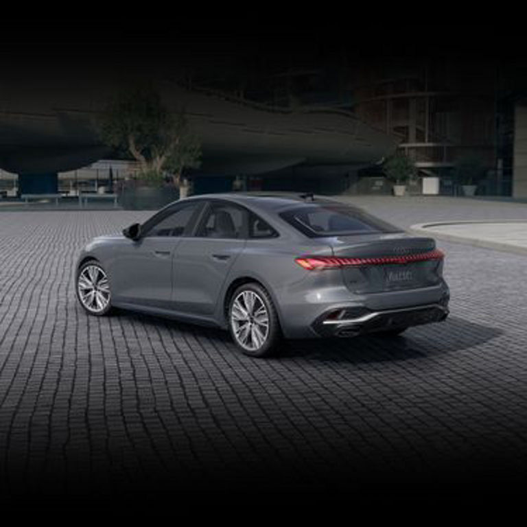 Three-quarter side view of the Audi A5 parked.