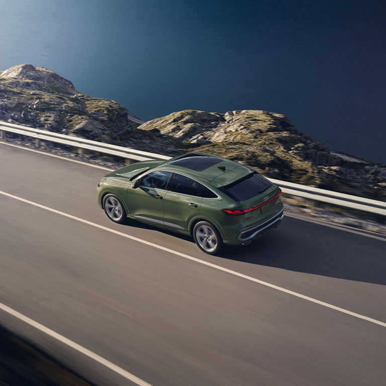 Aerial rear view of the all-new Audi Q5 Sportback in motion.