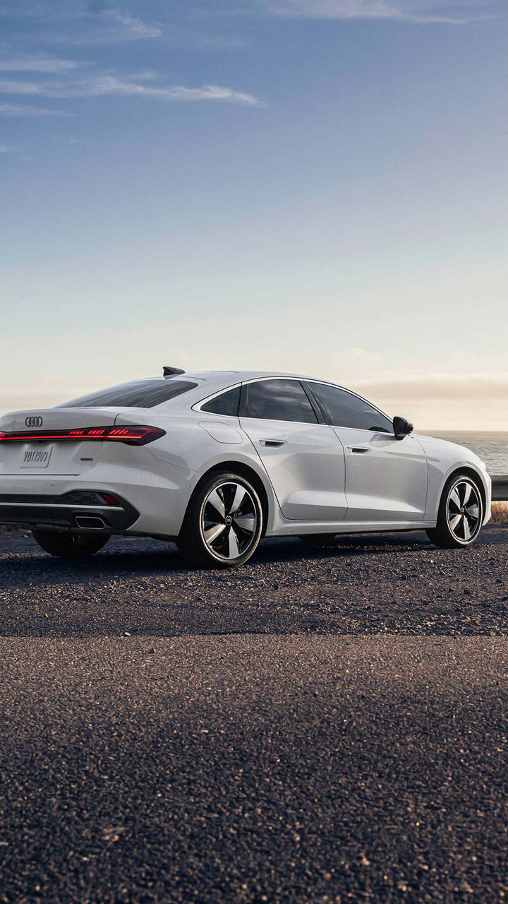 Three-quarter side profile of an Audi RS e-tron GT accelerating. 