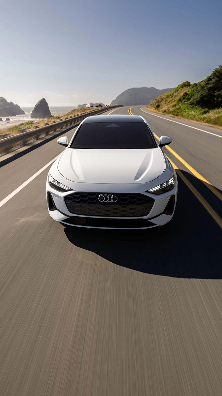 Three-quarter side profile of an Audi RS e-tron GT accelerating. 