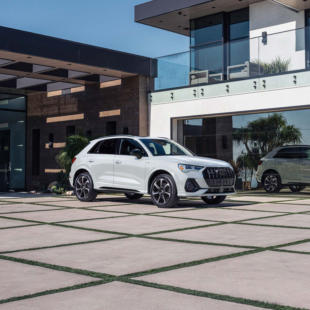 Front profile of the Audi Q6 e-tron in shadow. 