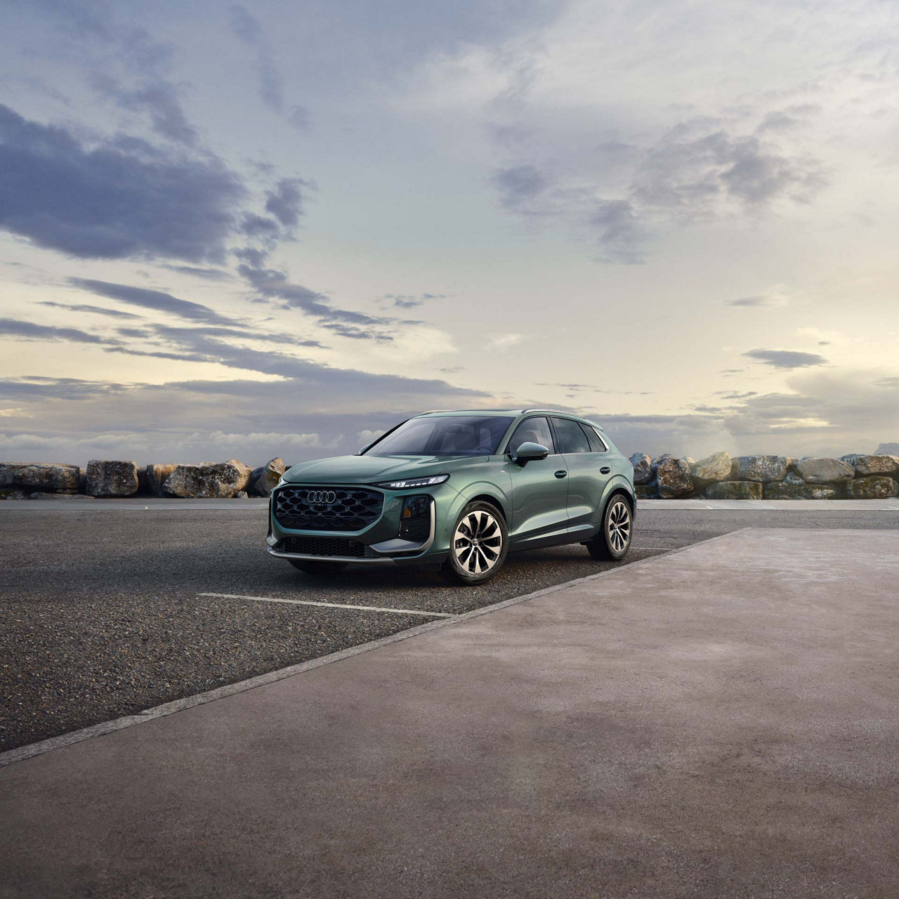 Front profile of the Audi Q6 e-tron in shadow. 
