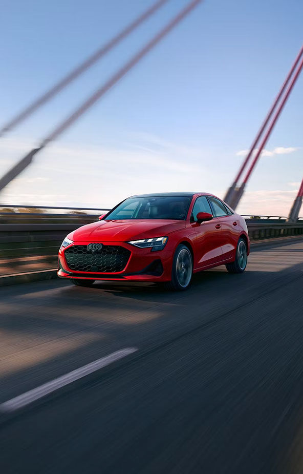 Official Audi front driving image of the current Audi A3 sedan.