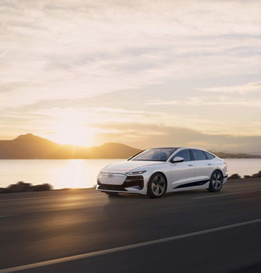 Three-quarter front view of the Audi RS e-tron GT accelerating.