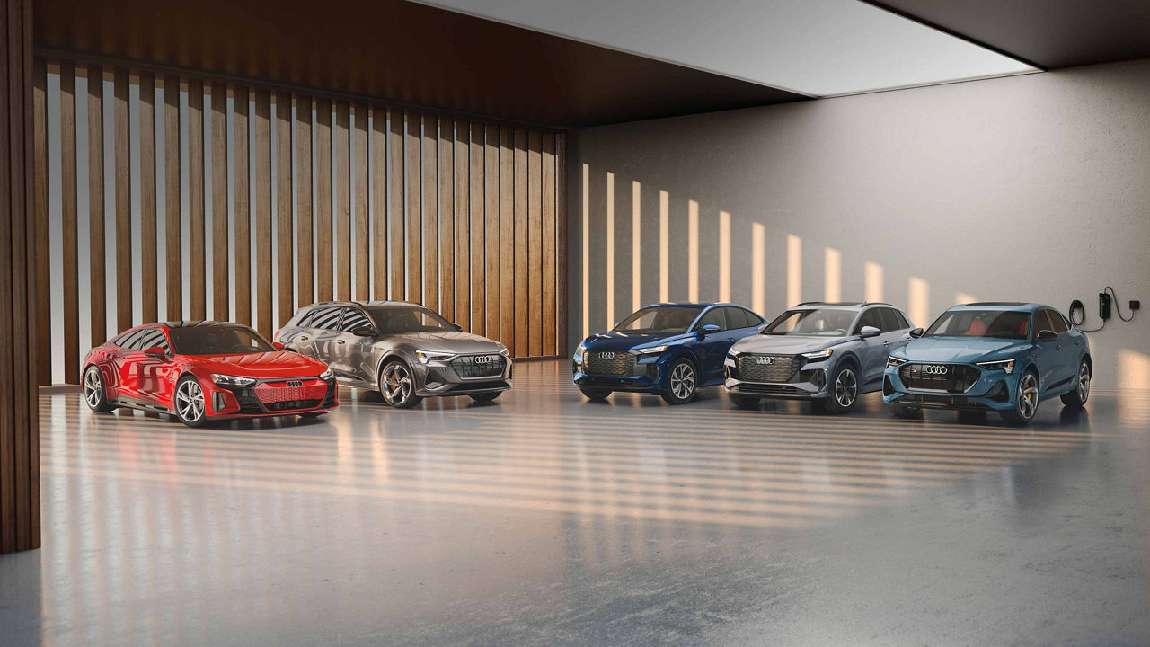 Lineup of Audi electric vehicles indoors.