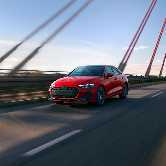 Three-quarter front view of the Audi A3 in motion.
