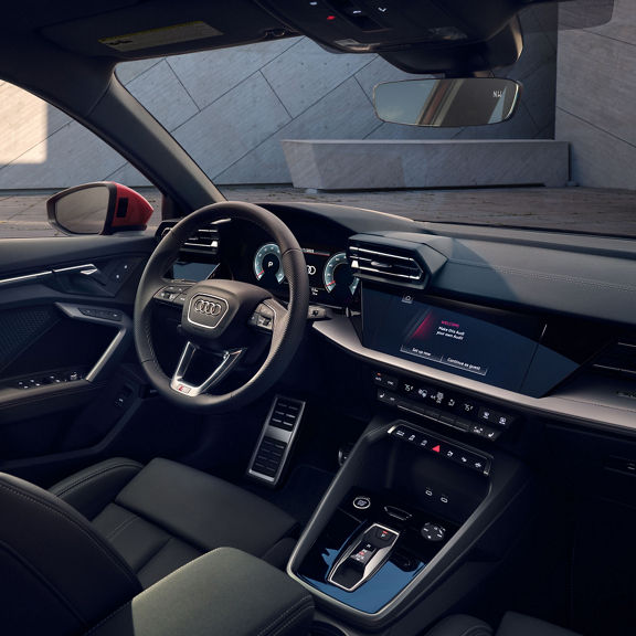 Interior view of the dashboard and front seat of the Audi A3.