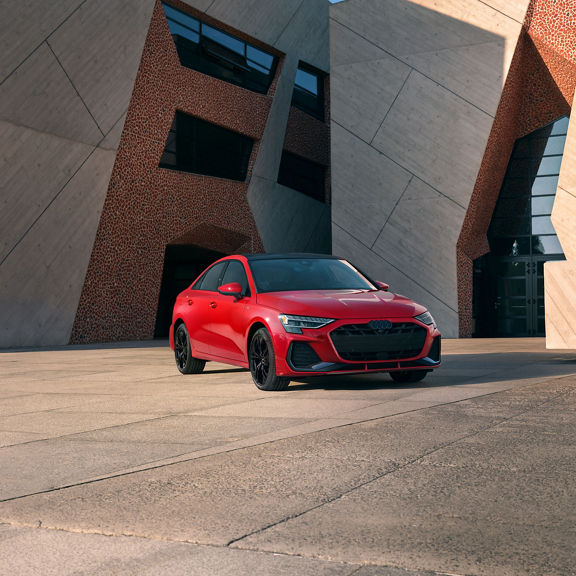 Three-quarter front-view of the Audi A3 parked.