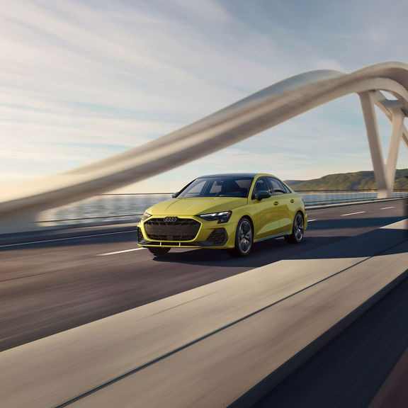 Three-quarter front view of the Audi S3 in motion.