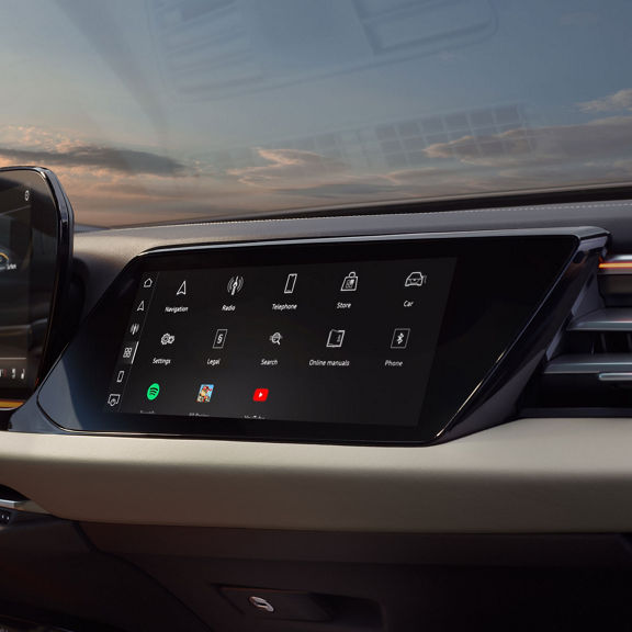 View of the interior cabin of the Audi A5, showing the passenger display screen and the dashboard.