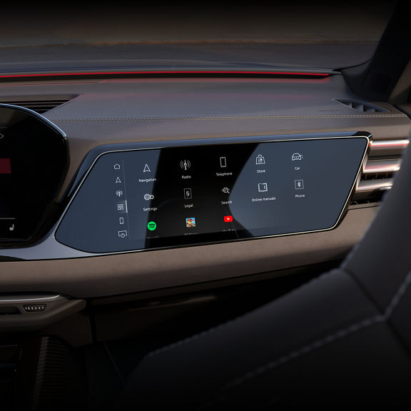 View of the interior cabin of the Audi S5, showing the passenger display screen and the dashboard.
