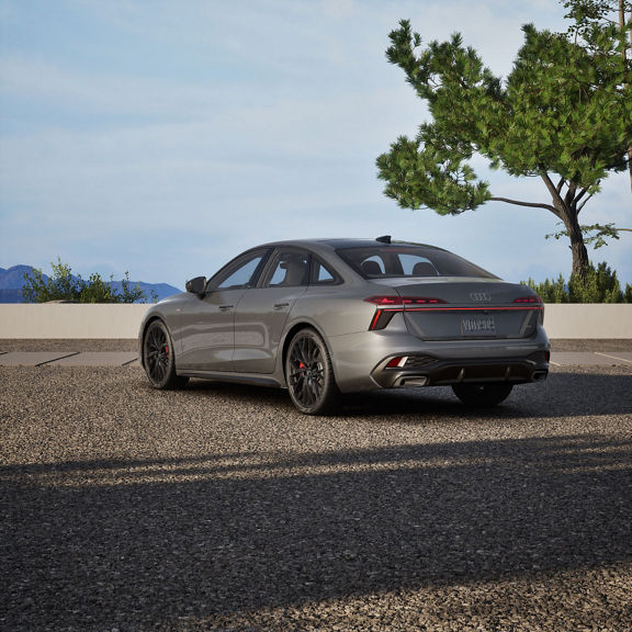 Rear 3/4 view of an Audi A6 Sedan parked.