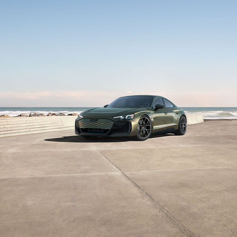 Front view of the Audi RS e-tron GT, showing the grille and headlights.