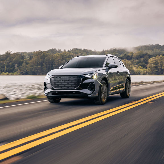 Front view of the Audi Q4 e-tron accelerating.