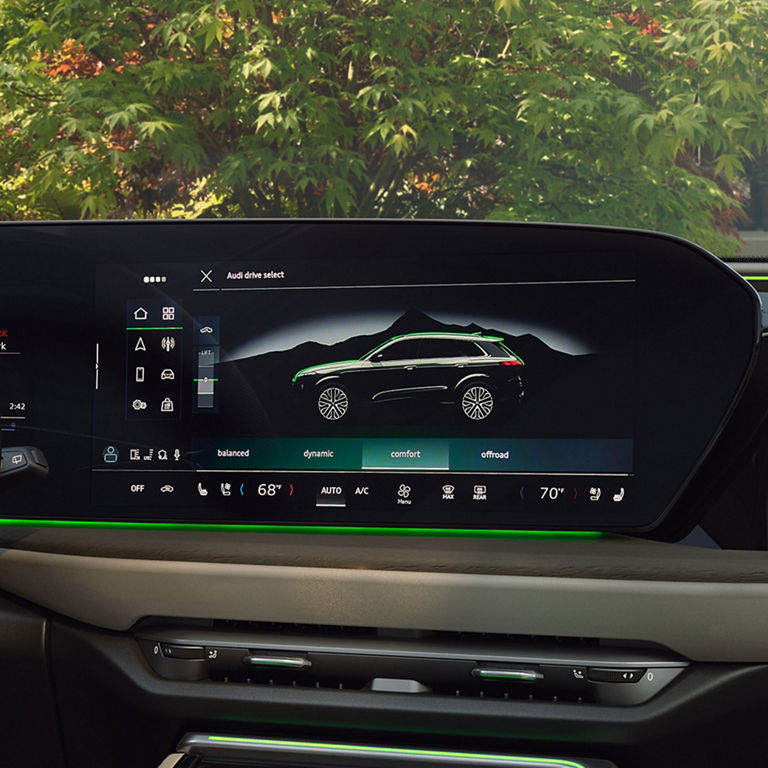 Close-up on the MMI display in the Audi SQ5 Sportback, showing the Audi drive select feature.
