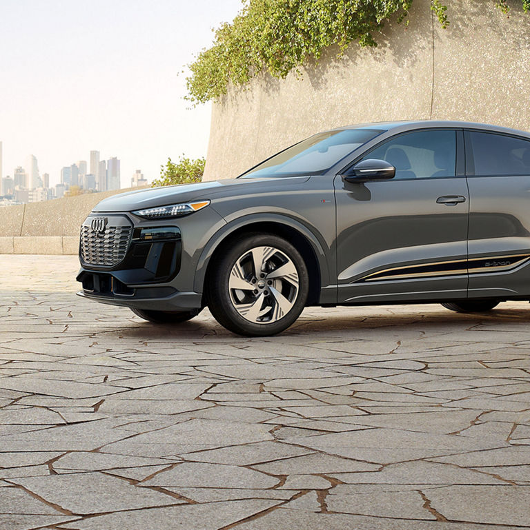Side view of the Audi Q6 Sportback e-tron, showing the front wheel.
