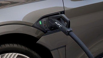 Close-up on the charging port on an Audi e-tron vehicle.