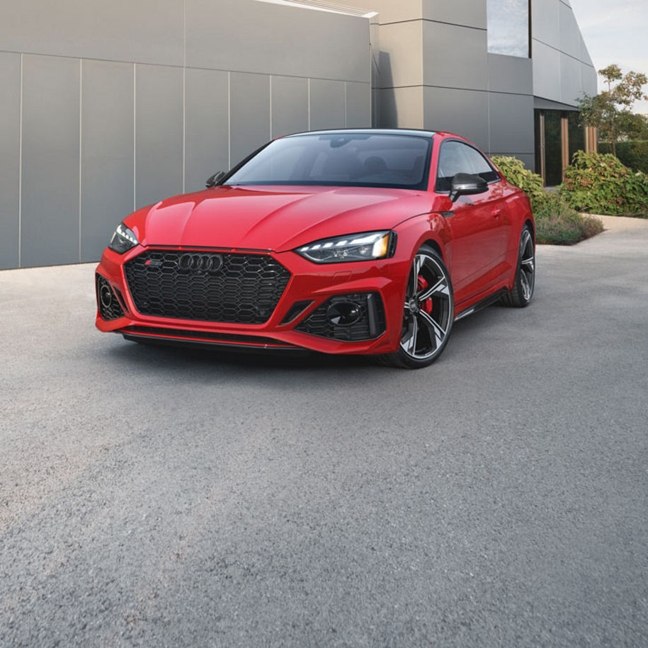 Three-quarter front view of the Audi RS 5 Coupe parked.