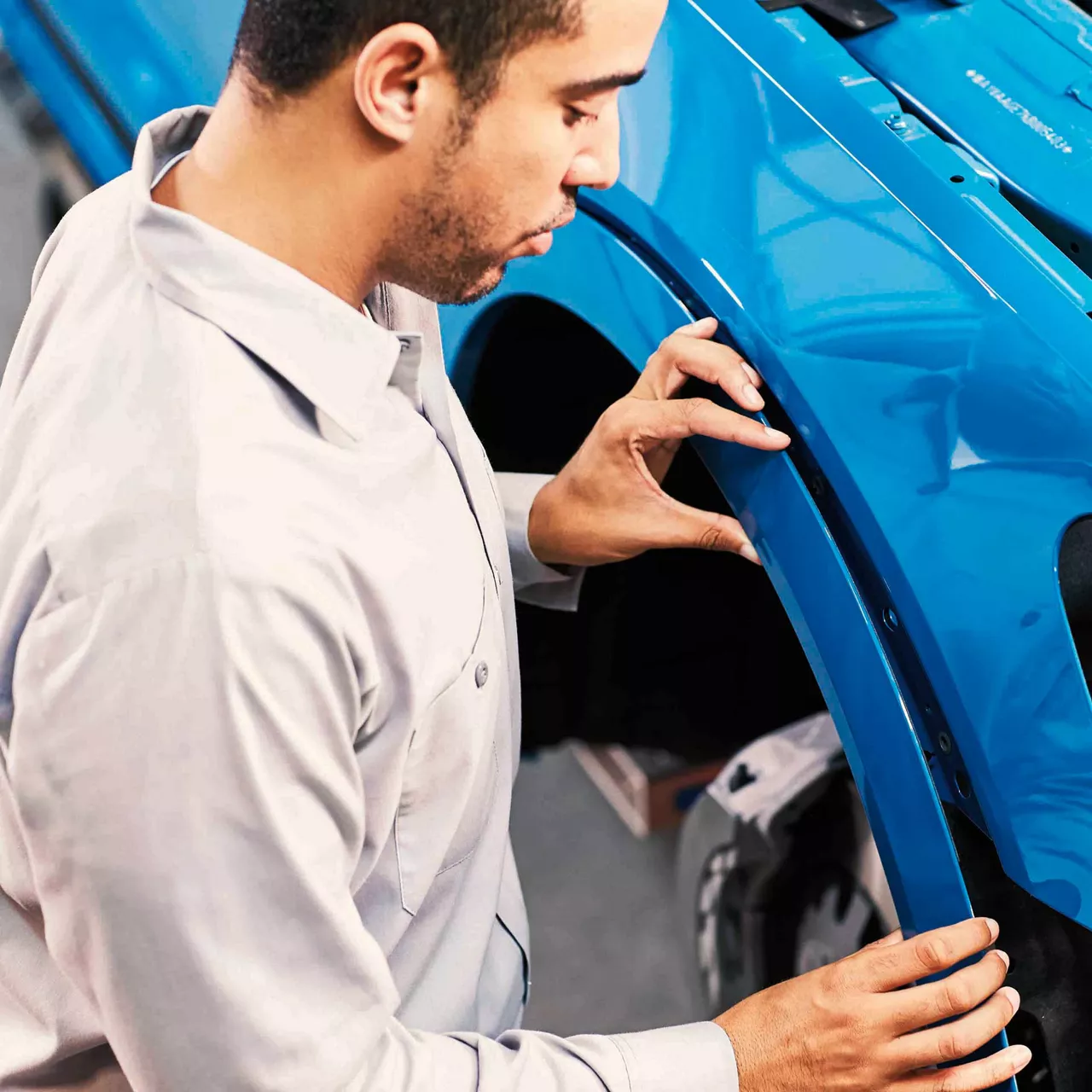 Graphic of the Audi Authorized Collision Repair Facility website on a smartphone.