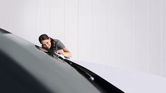 Service technician adjusting the cargo carrier.