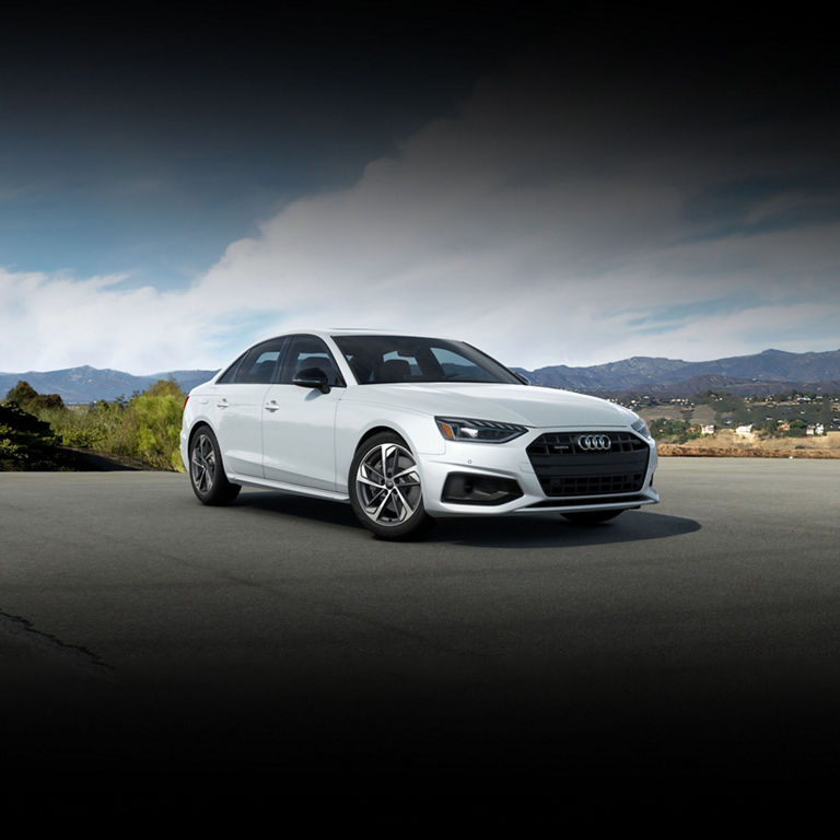 Three-quarter front view of the Audi A4 Sedan parked. 