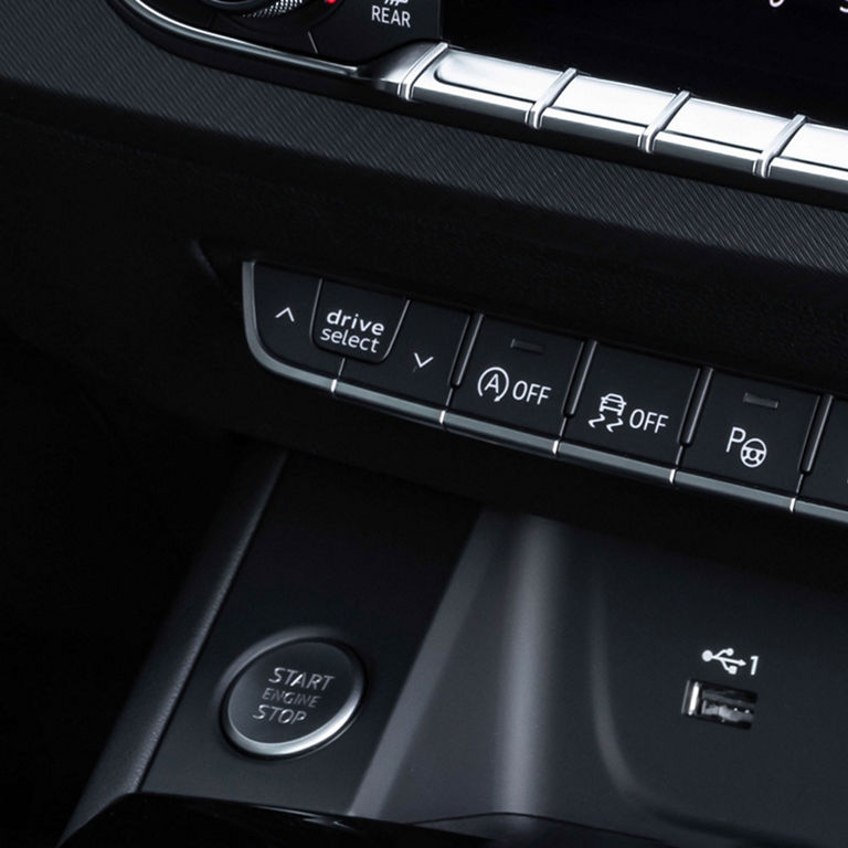 Close-up of the Audi Drive Select button in the Audi A4 Sedan.