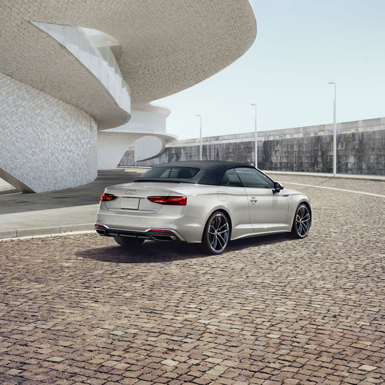 Three-quarter rear profile of the Audi A5 Cabriolet.