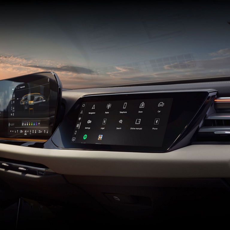 View of the interior cabin of the Audi A5, showing the passenger display screen and the dashboard.