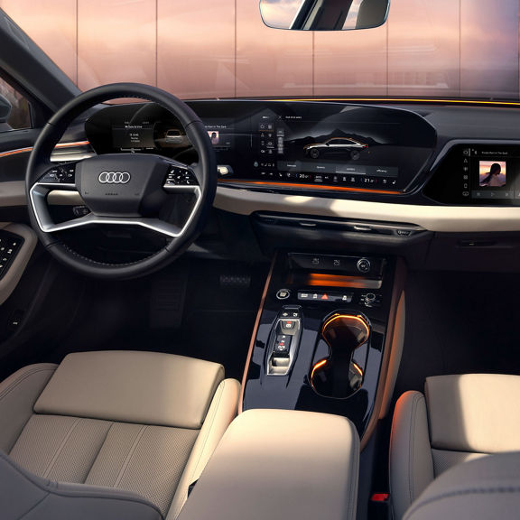 Interior view of the Audi A5, showing the gearbox, dashboard, and steering wheel.