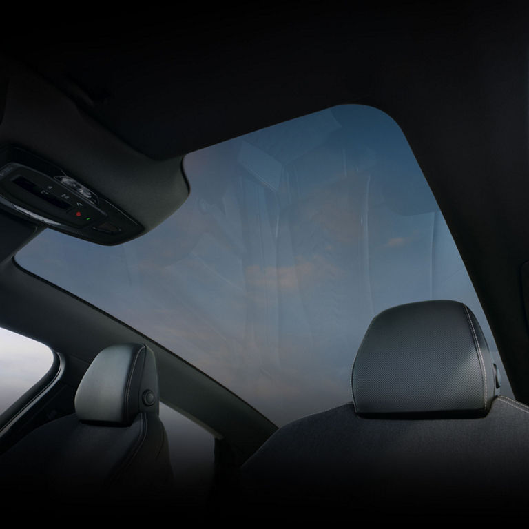 Interior view of the Audi A6 e-tron showing the panoramic glass roof.