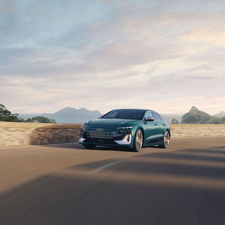 Three-quarter front view of the Audi S6 e-tron in motion.