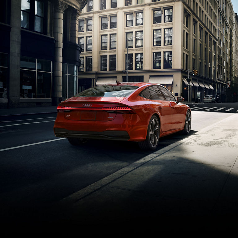 Three-quarter rear view of the Audi A7 parked. 