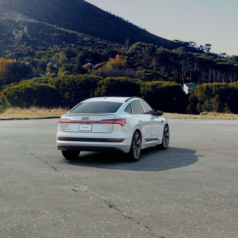 Rear three-quarter profile of the Audi e-tron Sportback. 
