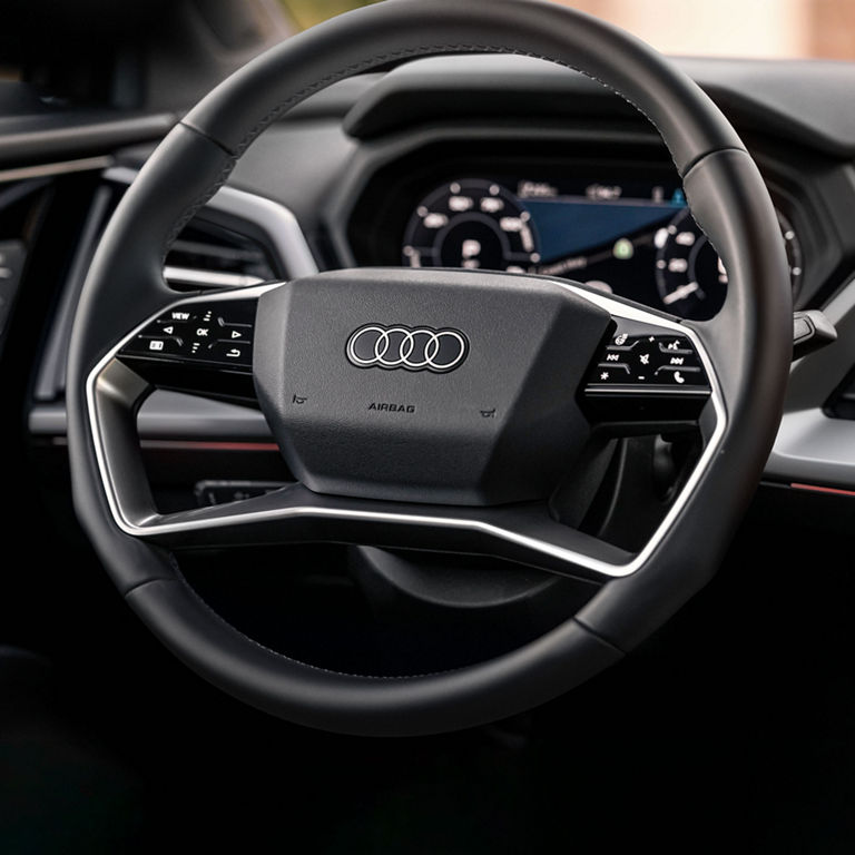 Close-up on the steering wheel of the Audi Q4 e-tron.