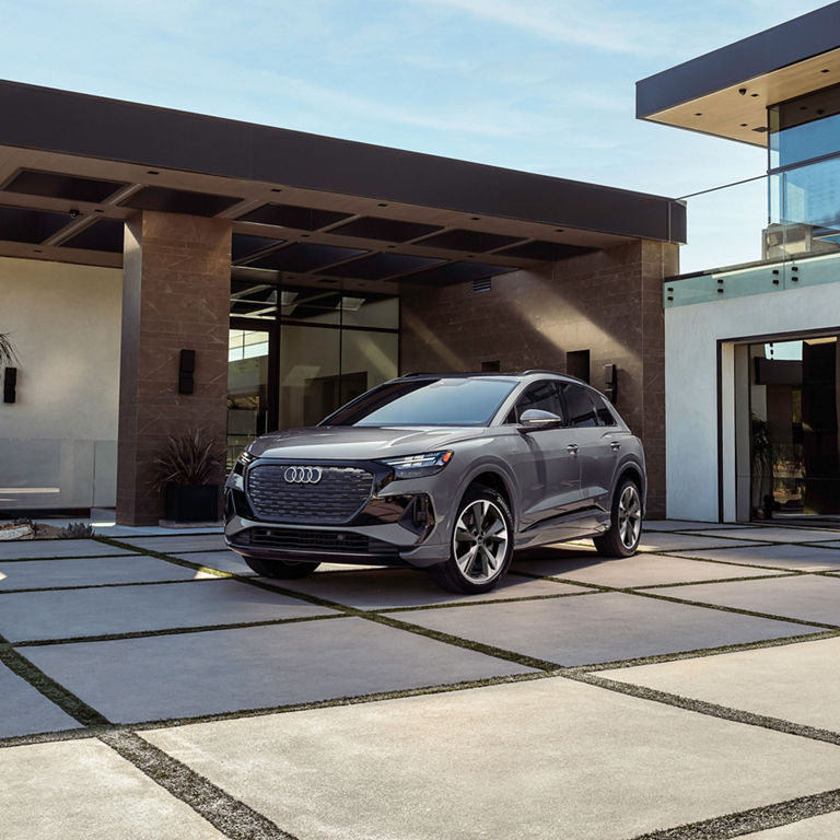 3/4 front profile of the Audi Q4 e-tron parked.