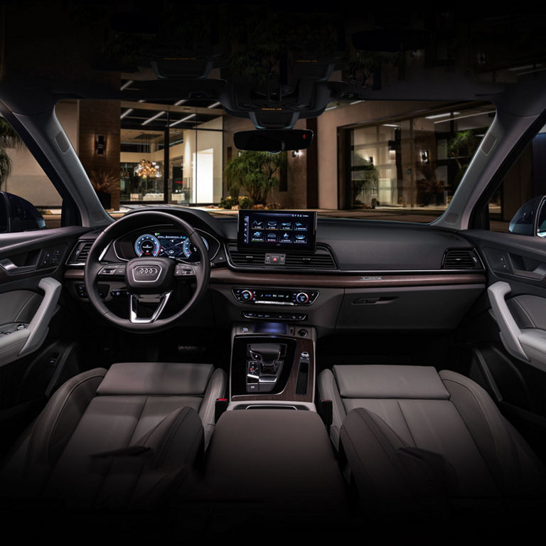 View of the interior cabin, showing the dash and front seats of the Audi Q5.