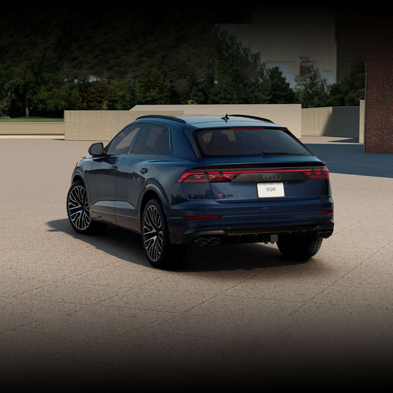 Three-quarter rear profile of the Audi SQ8 parked.