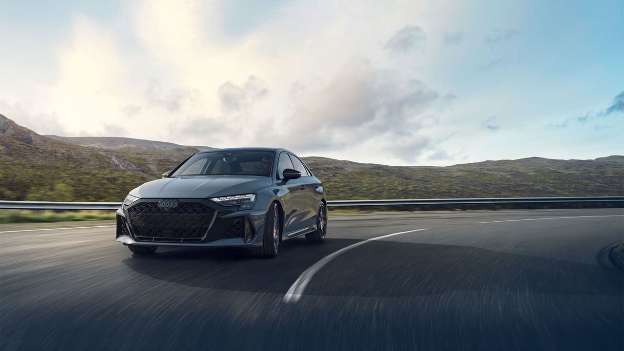 Front-view of the Audi RS 3 accelerating.