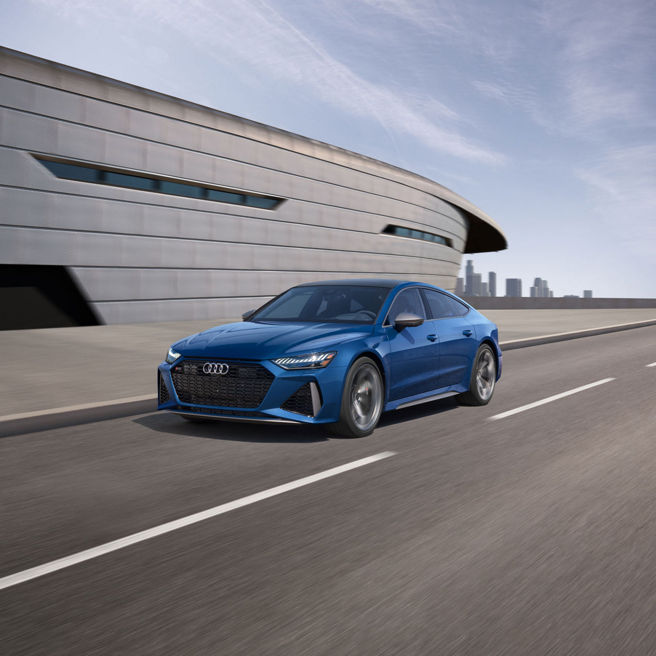 Three-quarter front view of the Audi RS 7 accelerating.