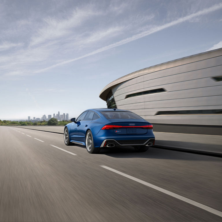 Rear 3/4 view of the Audi RS7 performance in motion.