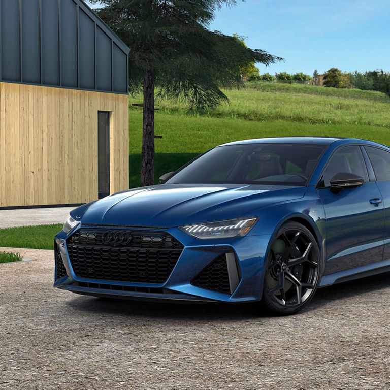 Side view of a parked Audi RS7 performance.