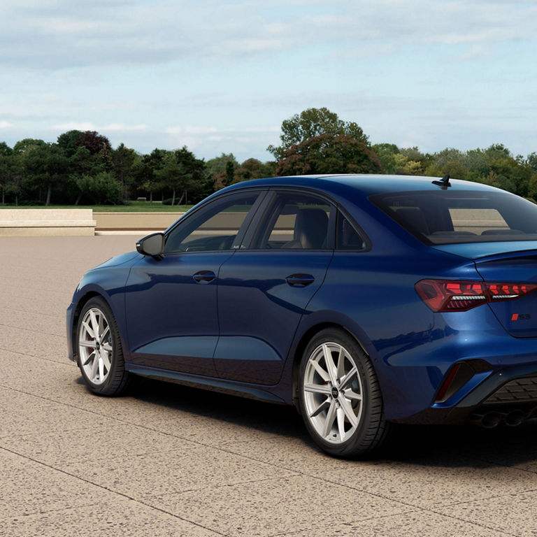 Rear 3/4 view of the Audi S3 in parked. 