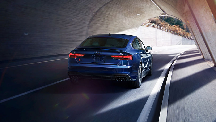 Rear view of the Audi S5 Sportback driving through a tunnel.