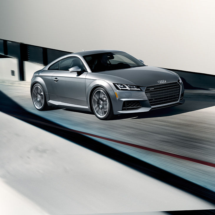Three-quarter front view of the Audi TT Coupé.