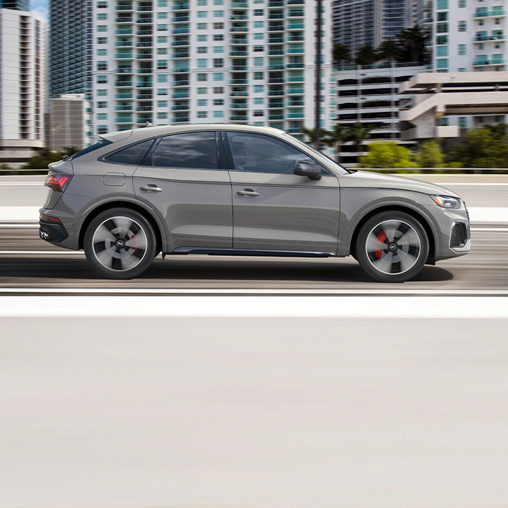 Side profile of the Audi SQ5 Sportback accelerating.