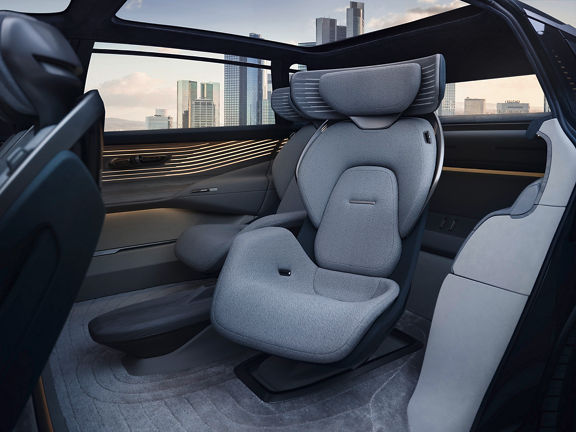 Interior view, in the center the rear left seat - slightly turned towards the door.