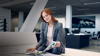 Audi customer reading a magazine.