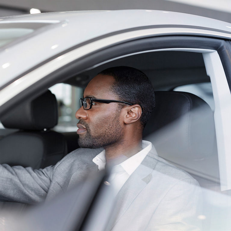 Audi customer sitting in his car purchased via Audi Financial Services.