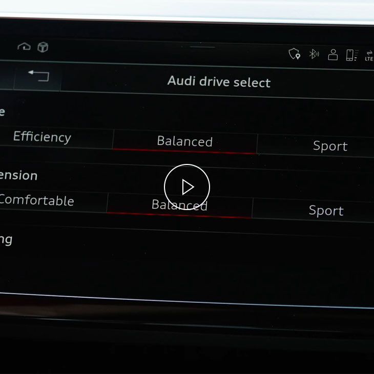 Close-up of the Audi MMI system displaying the drive select interface. 